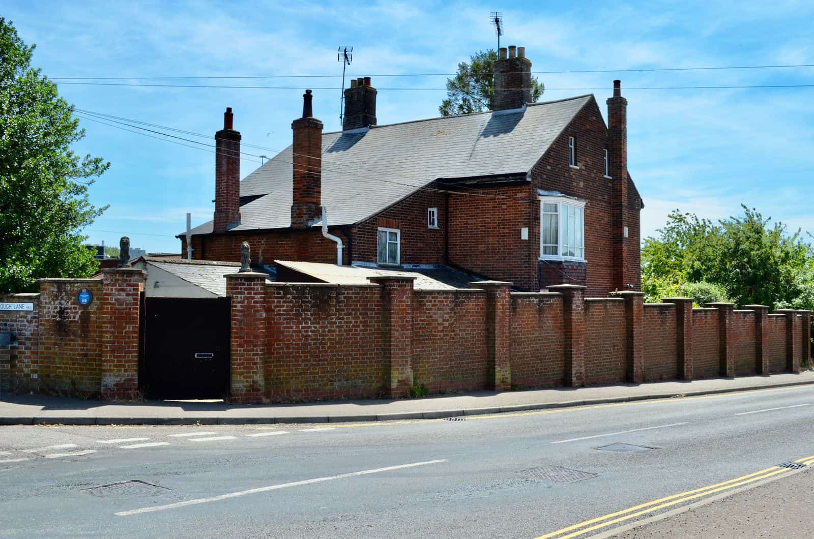 A row of brick chimneys along a rooftop