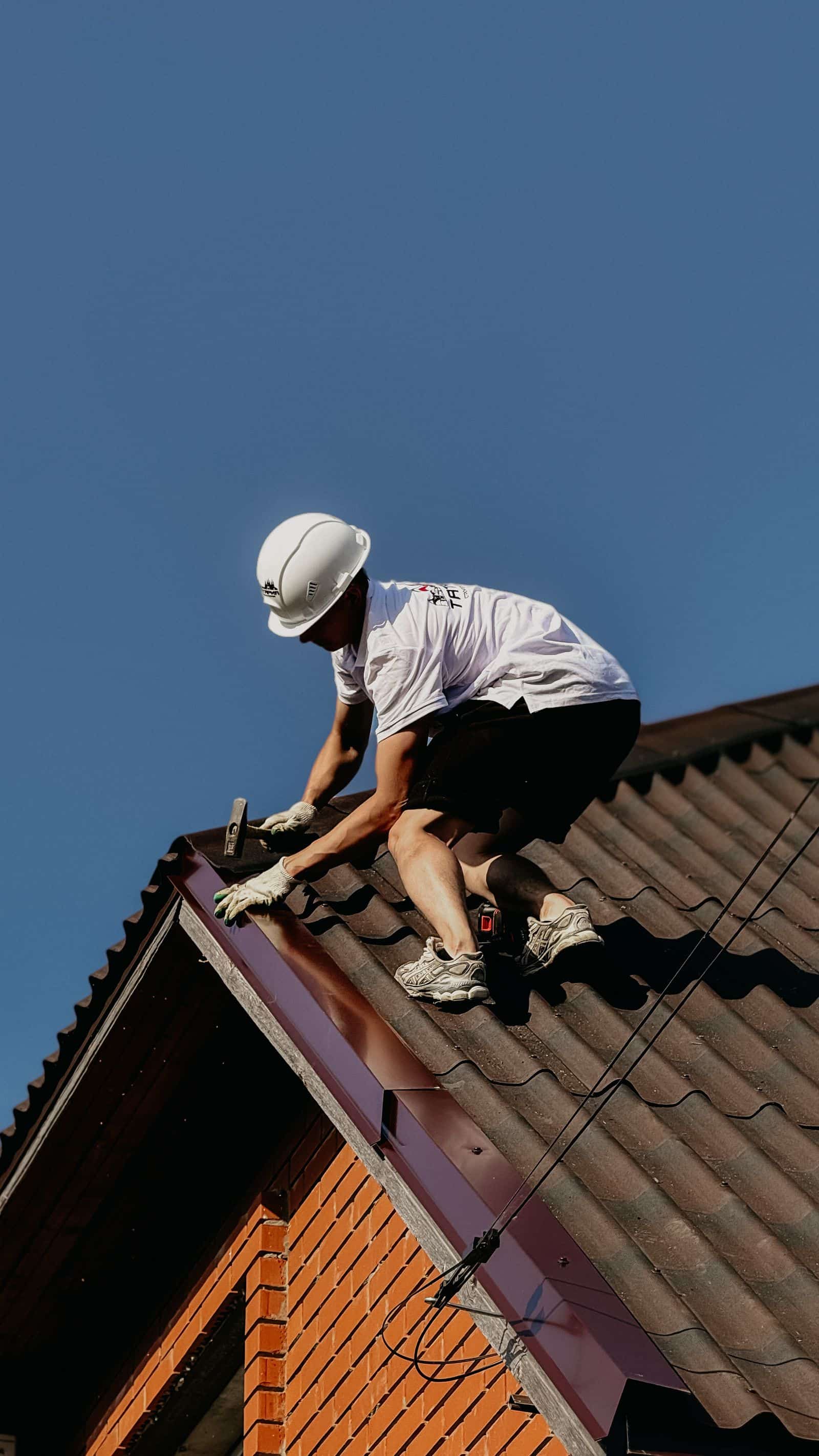 Brickwork being carried out on a rooftop chimney